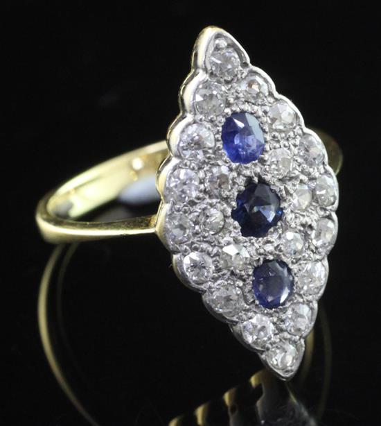 A 1940s 18ct gold sapphire and diamond marquise shaped ring, size O.